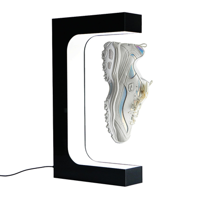 La mode faisant de la lévitation le présentoir de flottement magnétique de chaussures et l'affichage de magasin pour la fantaisie de chaussures divisent l'unité de visualisation de chaussures blanche