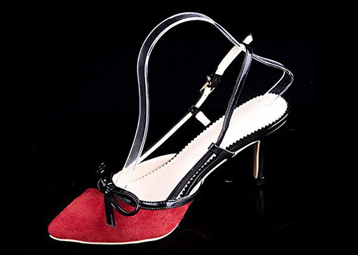 Le présentoir acrylique clair de chaussure insère le soutien de support de supports des chaussures des femmes
