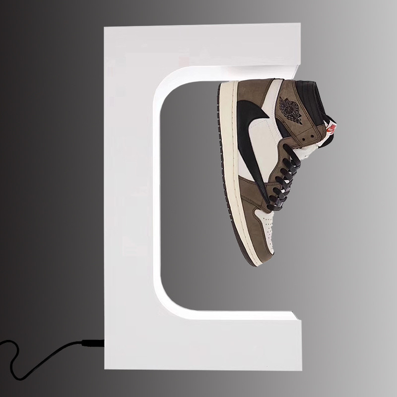 La mode faisant de la lévitation le présentoir de flottement magnétique de chaussures et l'affichage de magasin pour la fantaisie de chaussures divisent l'unité de visualisation de chaussures blanche